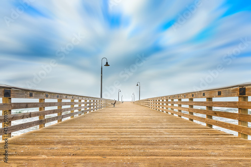 Fototapeta Naklejka Na Ścianę i Meble -  The wooden pier on the Cayucos State Beach, Cayucos California