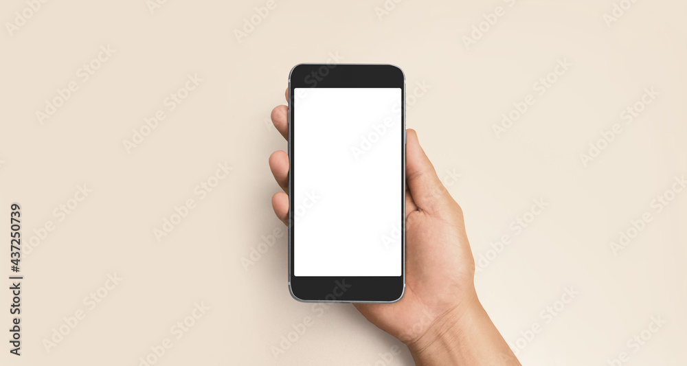 Hand holding smartphone device touching screen Hand holding smartphone device touching screen