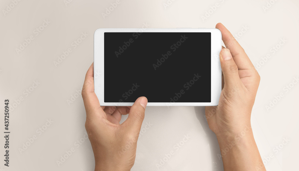 Hands holding tablet touch computer gadget Hands holding tablet touch computer gadget