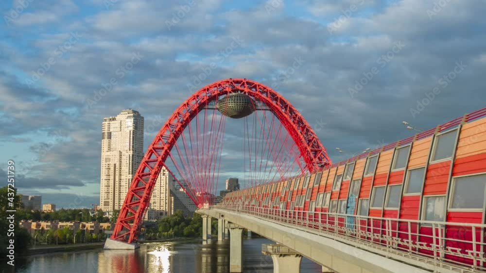 Zhivopisniy red modern cable-stayed bridge across the river at sunset, Moscow, Russia. Time lapse 4K