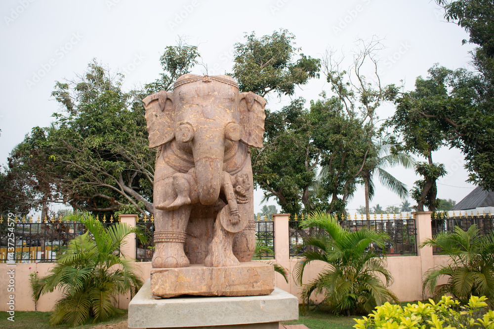 Elephant sculpture isolated over outdoor background