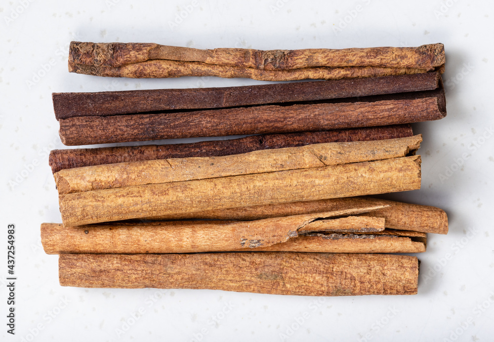 cassia (chinese cinnamon) sticks close up on gray cassia (chinese cinnamon) sticks close up on gray