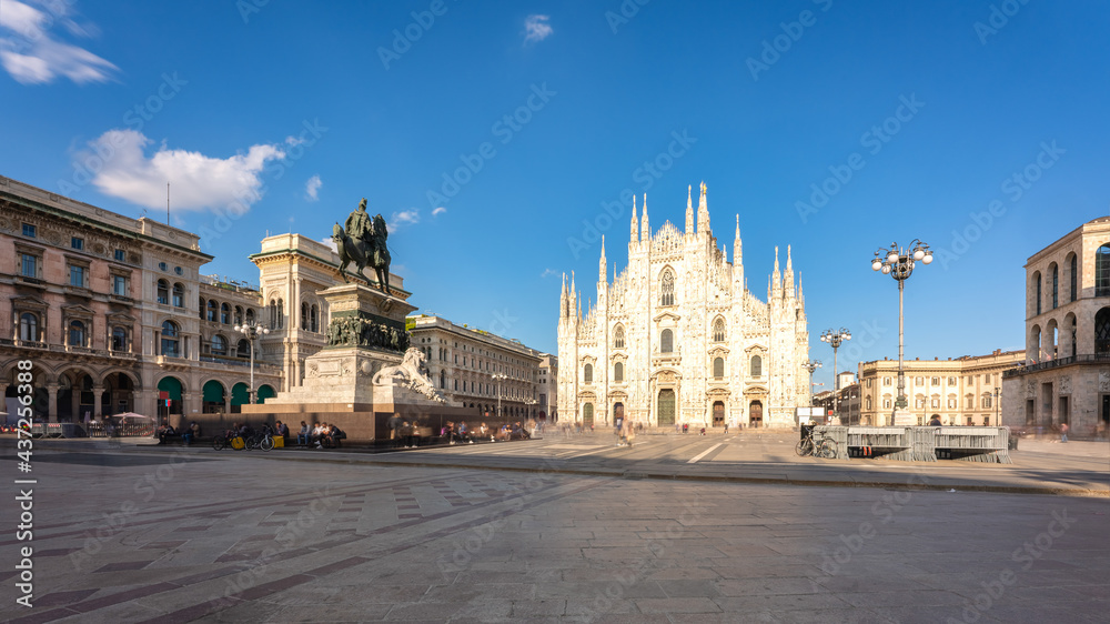 Long exposure of Milan cathedral Duomo and Vittorio Emanuele statue in Square 