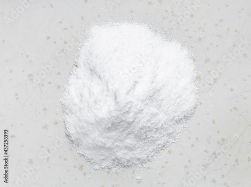 top view of pile of dextrose sugar closeup on gray