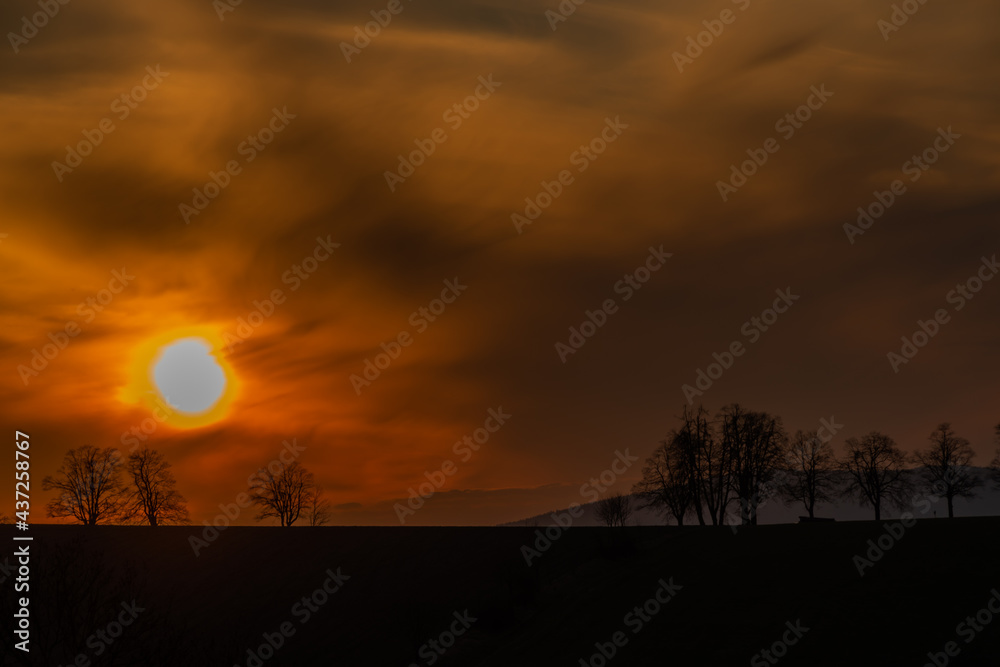 Sunset view in Roprachtice village in Krkonose mountains with color sky Sunset view in Roprachtice village in Krkonose mountains with color sky