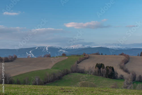 Sunset view in Roprachtice village in Krkonose mountains with color sky photo