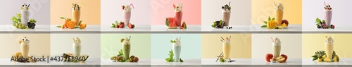 Set of various flavors milkshakes decorated with fruits colored background photo