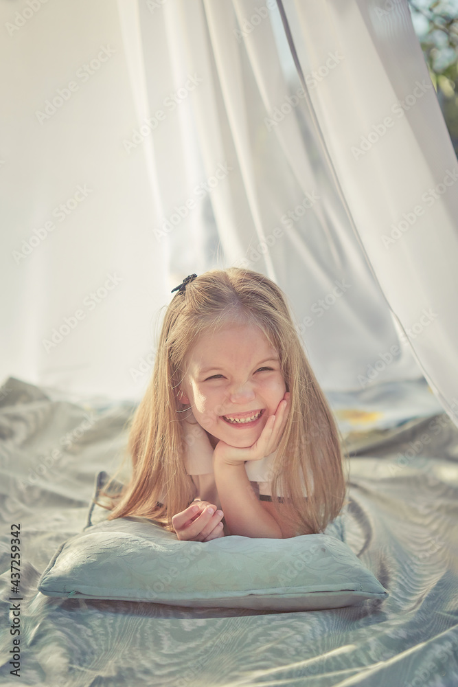 Little girl in white chiffon tent