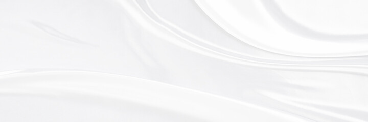 White gray satin texture that is white silver fabric silk panorama background with beautiful soft blur pattern natural.