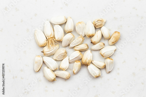 several safflower seeds close up on gray photo