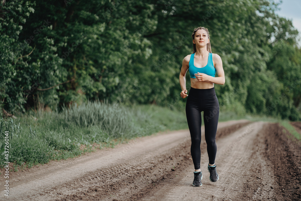 Active woman jogging in the countryside. Sport Active woman jogging in the countryside. Sport