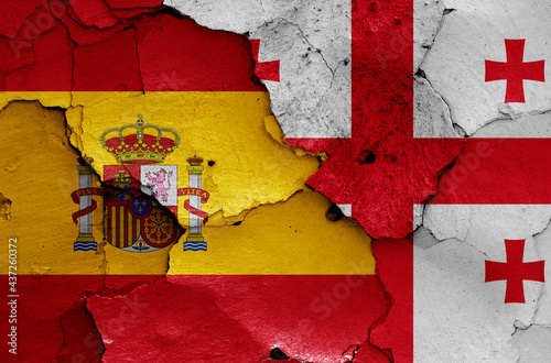 flags of Spain and Georgia painted on cracked wall photo