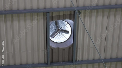 Roof ventilation fan in the bottom view. Metal ventilator turbines on factory roofs or exhaust fans for cooling and indoor air circulation. photo