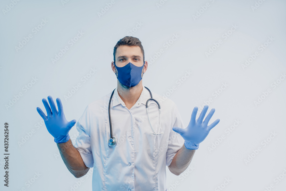 Male doctor in protective mask and latex gloves Male doctor in protective mask and latex gloves