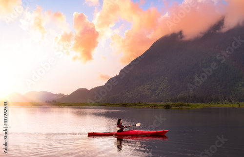 Adventure Caucasian Adult Woman Kayaking in Red Kayak surrounded by Canadian Mountain Landscape. Sunset Sky Art Render. Widgeon Valley, Pitt Meadows, Vancouver, British Columbia, Canada. © edb3_16