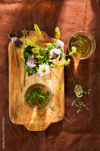herbal tea on a tray with meadow flowers