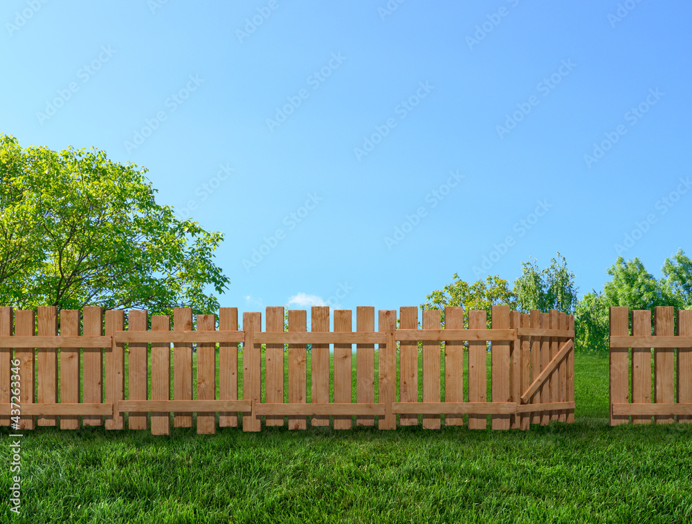 Fototapeta premium wooden garden fence at backyard and trees in summer