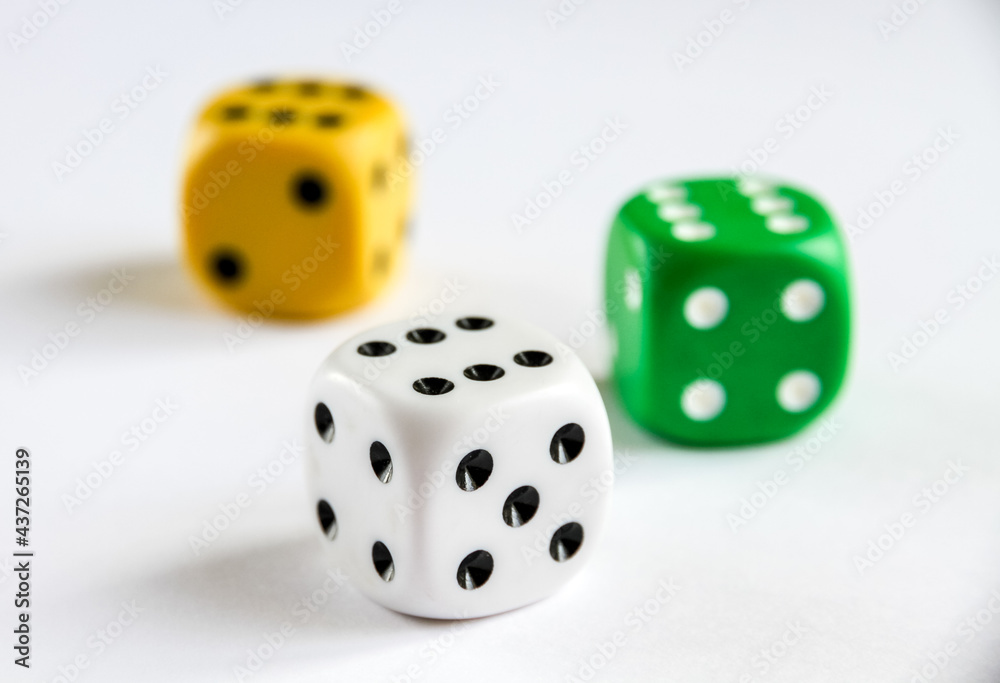 Three colorful dices isolated on white background Three colorful dices isolated on white background
