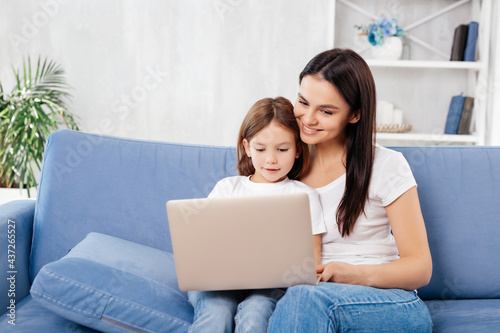 Young family with a laptop on knees