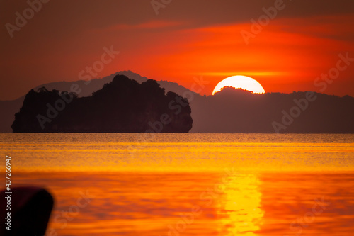 sunset over the sea © nattawut
