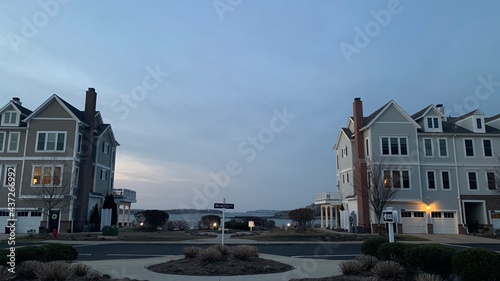Hingham Shipyard condos in the sunset, Streets lit by streetlights photo