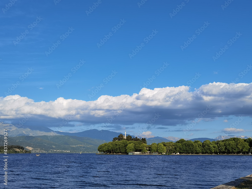 ioannina or giannena city lake  clouds like hat in  spring greece