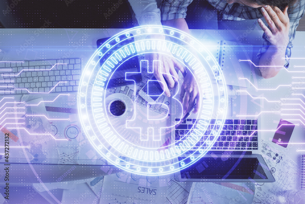 Double exposure of man and woman working together and crypto theme hologram drawing. Computer background. Blockchain concept. Top View. Double exposure of man and woman working together and crypto theme hologram drawing. Computer background. Blockchain concept. Top View.