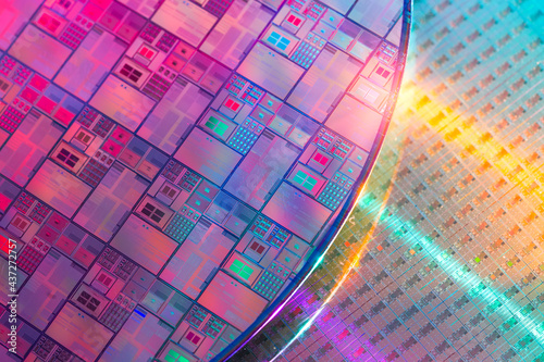 Silicon Wafer with microchips used in electronics for the fabrication of integrated circuits. photo