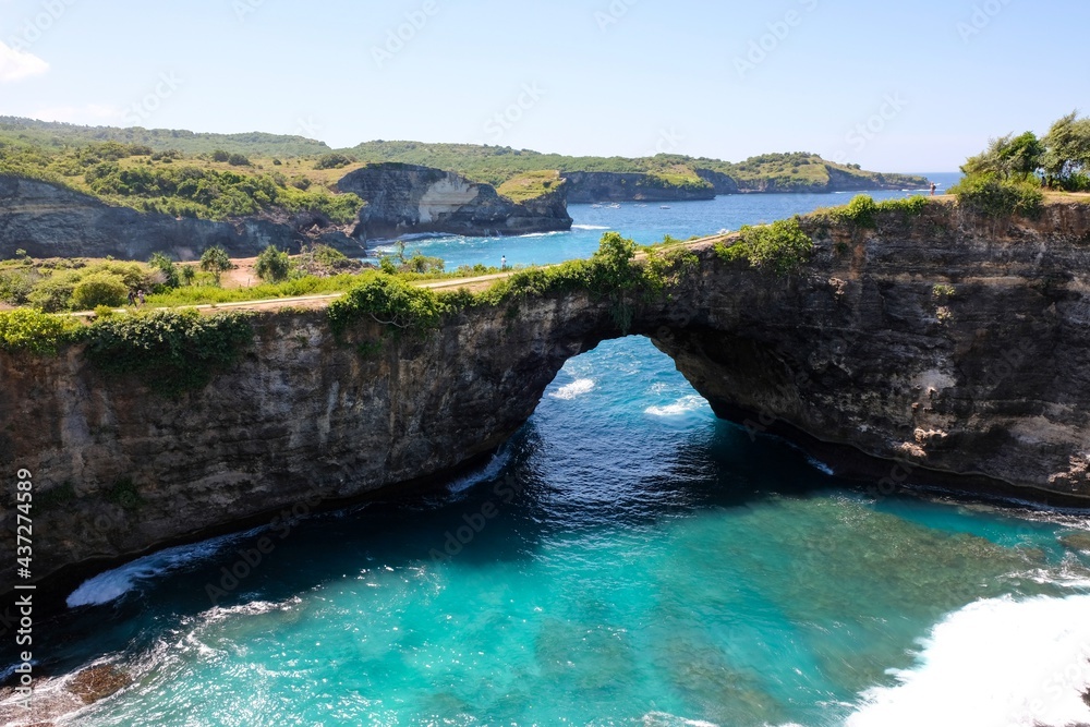 Naklejka premium Broken beach . Bali travel destination. Nusa Penida island day tour popular place. Amazing activity on beach holiday