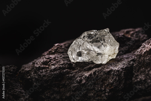 Quartz crystal on stone background, concept of semi precious stone mining