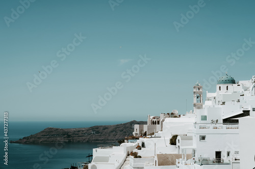 Scenic cityscape of Imerovigli. city on the hill. White architecture. Santorini island, Greece. Aegean sea. Luxury tourism.