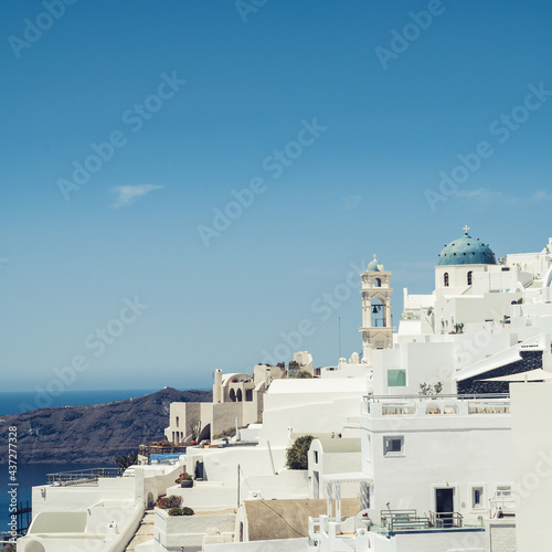 Scenic cityscape of Imerovigli. city on the hill. White architecture. Santorini island, Greece. Aegean sea. Luxury tourism.