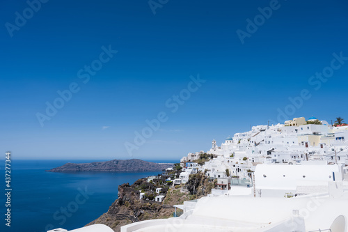 Scenic cityscape of Imerovigli. city on the hill. White architecture. Santorini island, Greece. Aegean sea. Luxury tourism.