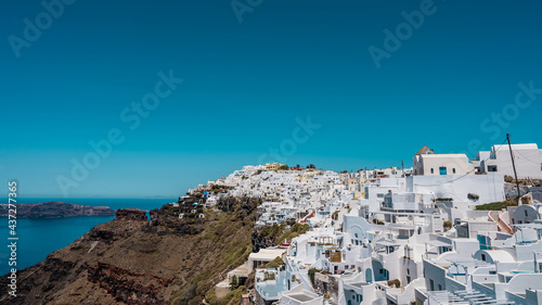 Scenic cityscape of Imerovigli. city on the hill. White architecture. Santorini island, Greece. Aegean sea. Luxury tourism.