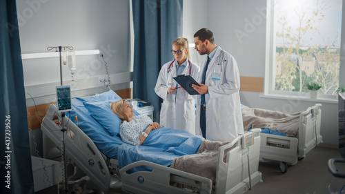 Hospital Ward: Male and Feamle Professional Caucasian Doctors Talk with a Patient, Give Health Care Advice, Recommend Treatment Plan. Modern Clinic with Advanced Equipment and Best Medicare Service