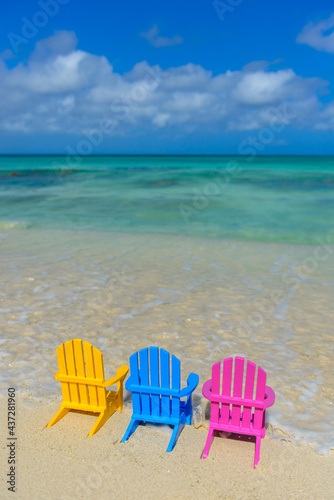 Colorful beach chairs on the shoreline, beach in Aruba