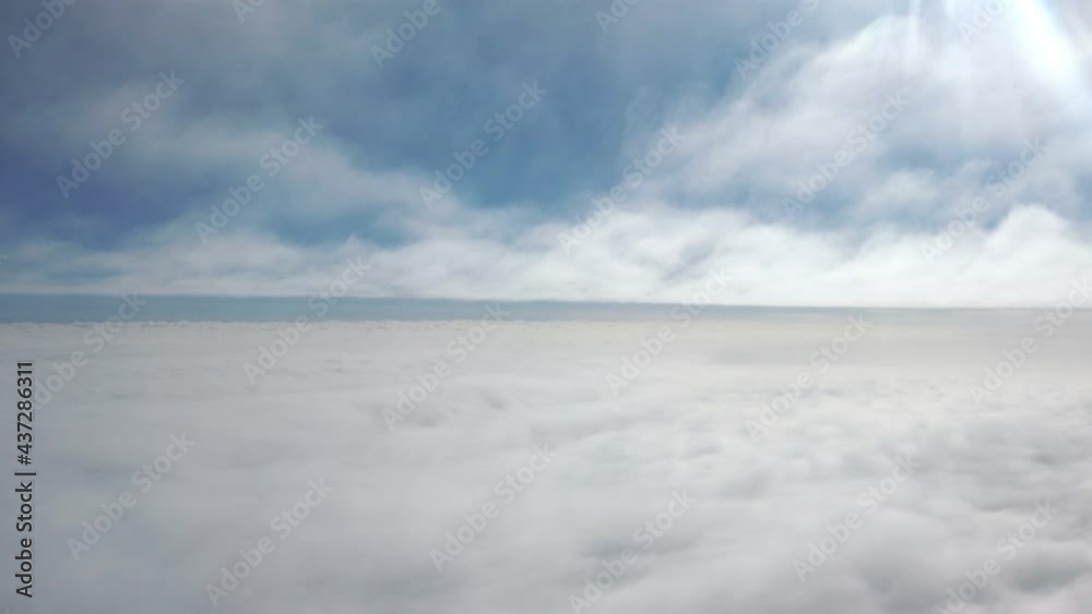 Flight above the clouds in 4k