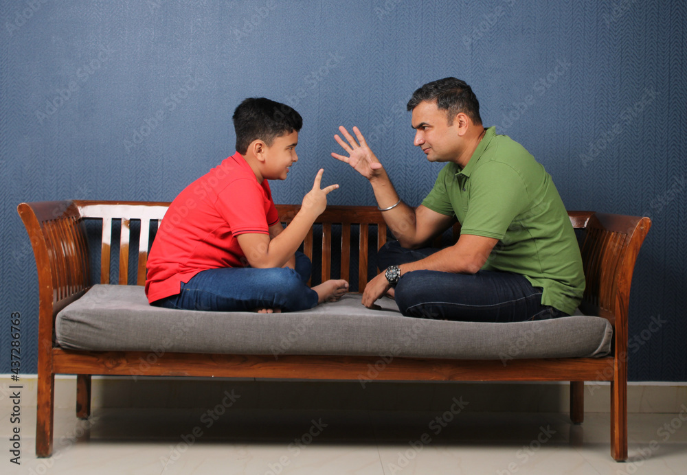 Father's day concept- Indian father and son spending quality time with each other. Father's day concept- Indian father and son spending quality time with each other.