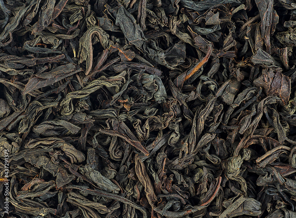 Background texture of dried black tea leaves. Chinese tea. Background texture of dried black tea leaves. Chinese tea.