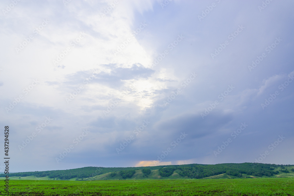 Blue sky and green meadow with mountains. Blue sky and green meadow with mountains.