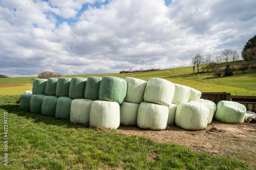 Wallpaper Mural green agricultural farmland with hay bales Torontodigital.ca
