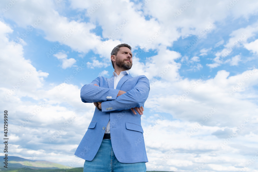 handsome man businessman in formal suit check time on wristwatch on sky background, agile business. handsome man businessman in formal suit check time on wristwatch on sky background, agile business.