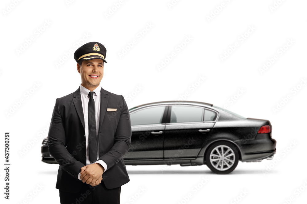 Young chauffeur standing in front of a black car Young chauffeur standing in front of a black car