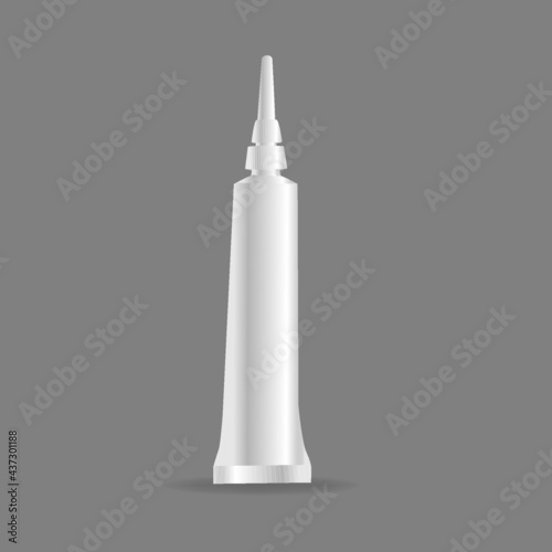 plastic tube with a long cap for vector paints on a gray background