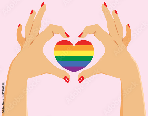 Hands making love symbol with LGBT heart flag