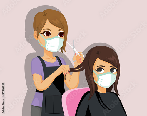 Young professional hairdresser working with face medical mask on coronavirus pandemic time