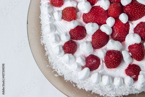 Creamy strawberry cake. Homemade cake with whipped cream and fresh strawberries. Light dessert