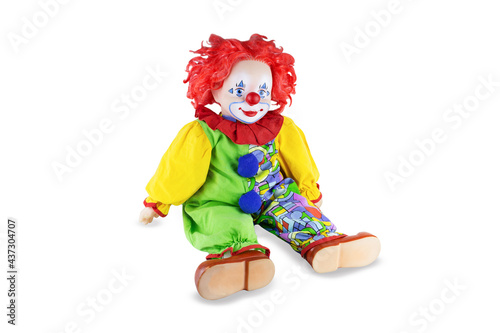 Toy clown in multicolored costume, isolated on white background.