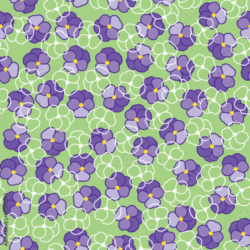 Seamless floral pattern with purple violas and pansies with green leaves.