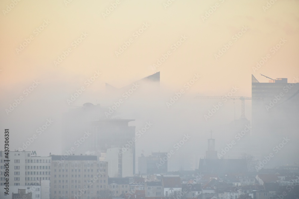 City centre and buildings are covered by morning mist